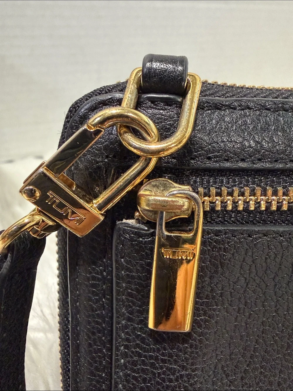 TUMI Crossbody with Gold tone Logo Accent Plate - Picture 13 of 16